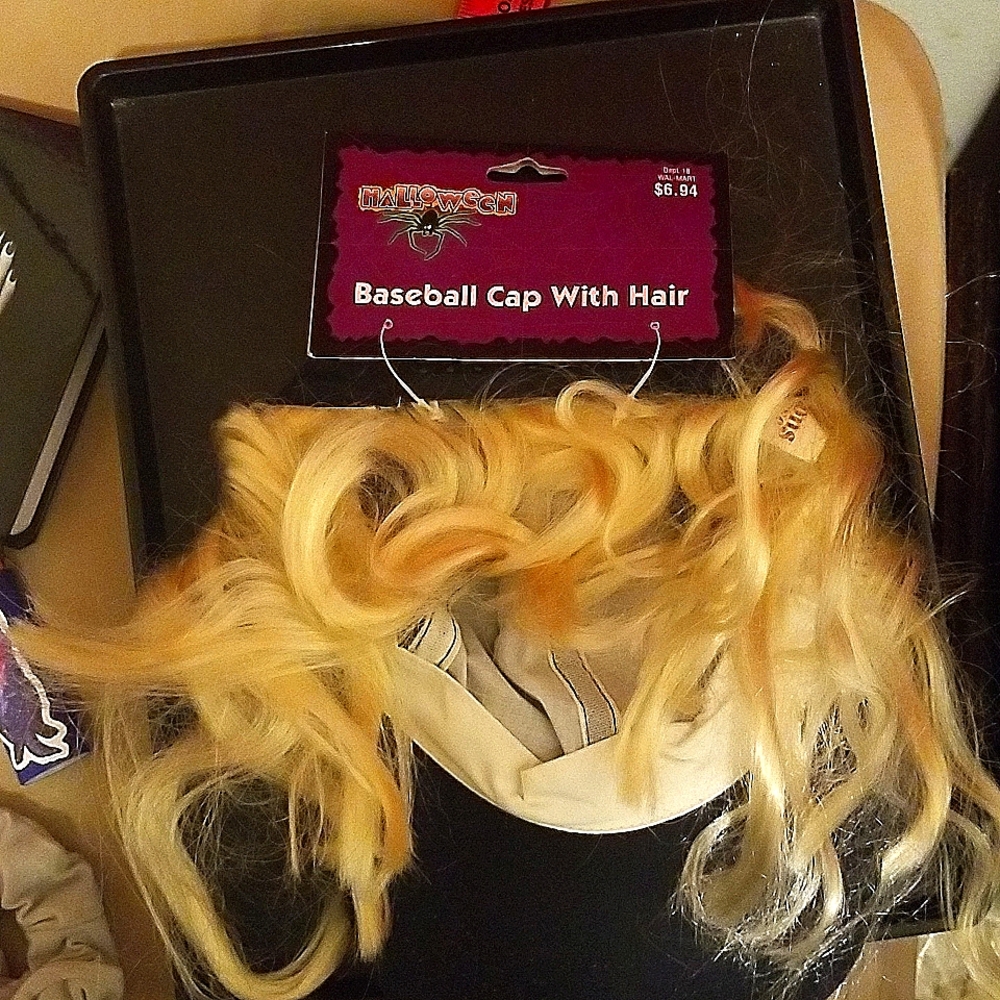 Blonde wig and ball cap woth blonde hair; addtl costume hat as well
